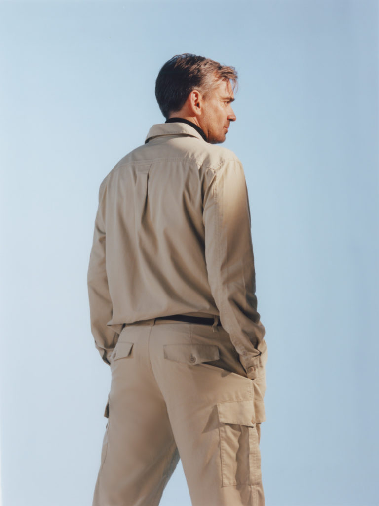 He wears an outfit by COS.