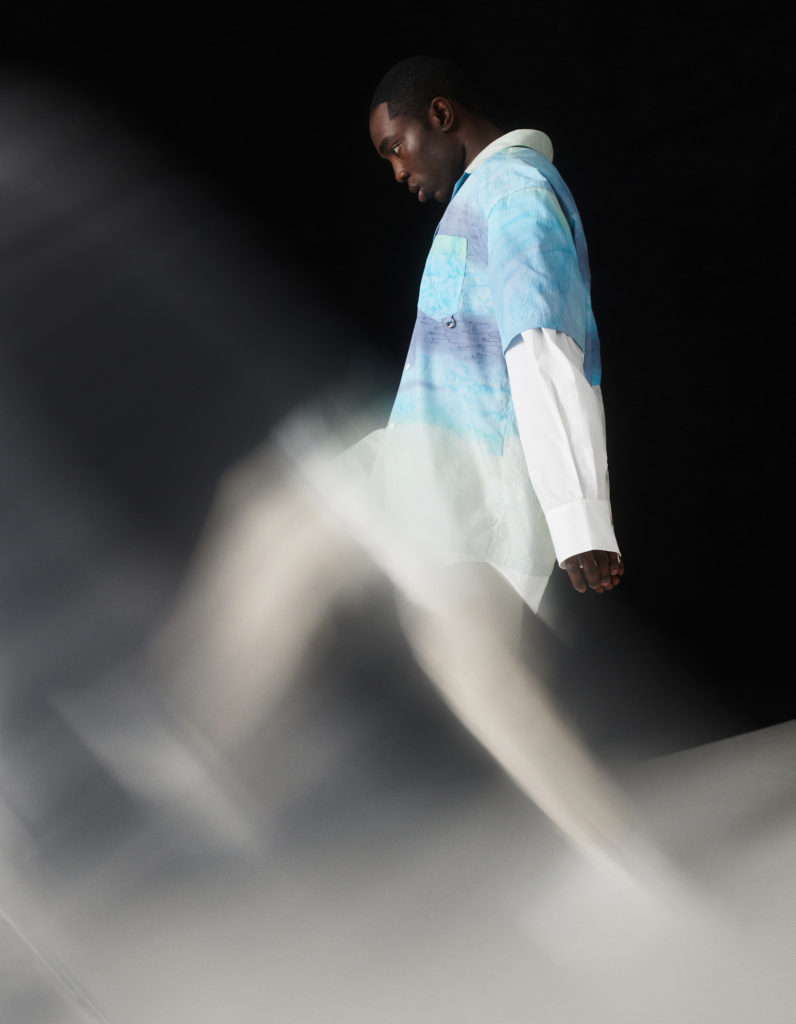 Essiedu wears a shirt by FENG CHEN WANG, trousers by OLIVER SPENCER and sneakers by COS.