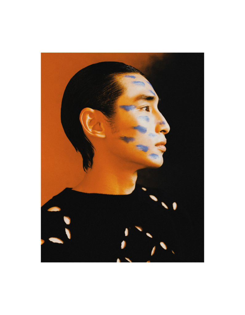 Nash wears a sweater by TERRENCE ZHOU.