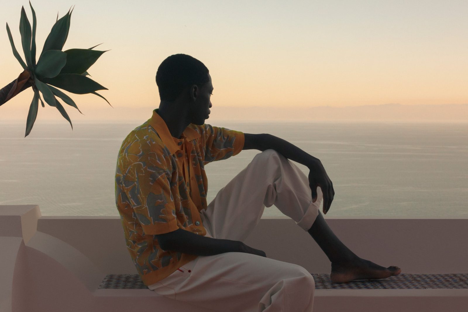 He wears an outfit by HERMÈS.